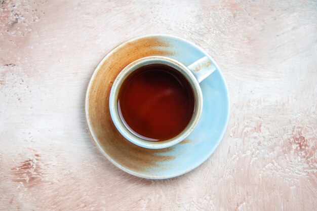 Top view cup of tea on light 