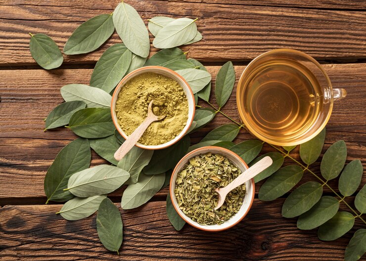Top view cup of tea and natural herbs leaves