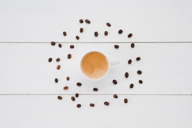 Top view cup of tea surrounded by grains