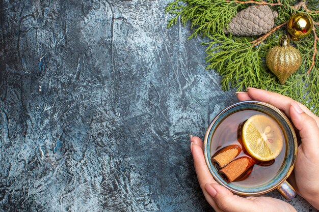 Top view cup of tea with cinnamon on light background