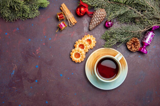 Top view cup of tea with cookies on dark desk tea cookie biscuit cake