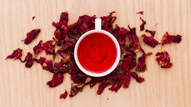 Top view cup of tea with dry leaves