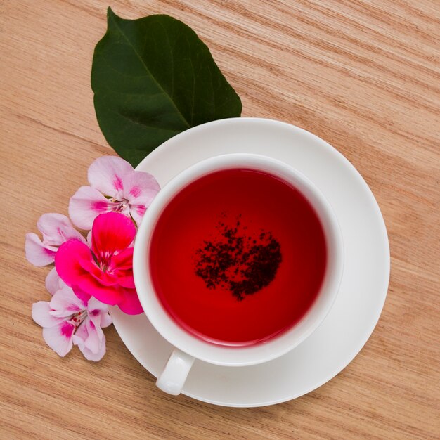 Top view cup of tea with flower