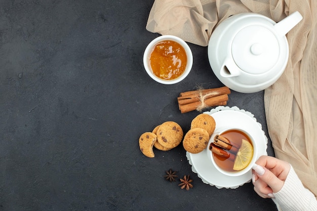 Top view cup of tea with honey and biscuits on dark background meal ceremony breakfast food color lemon cookies lunch