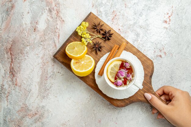 Top view cup of tea with lemon slices on white background drink citrus fruit tea