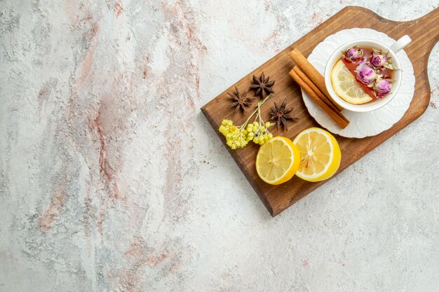 Top view cup of tea with lemon slices on white desk tea drink citrus fruit