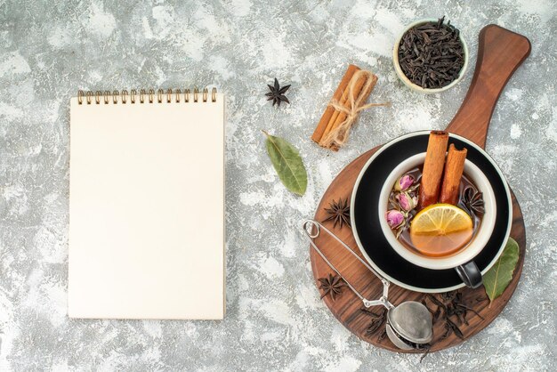 Top view cup of tea with lemon on white background ceremony flavor color morning breakfast food fruit flowers