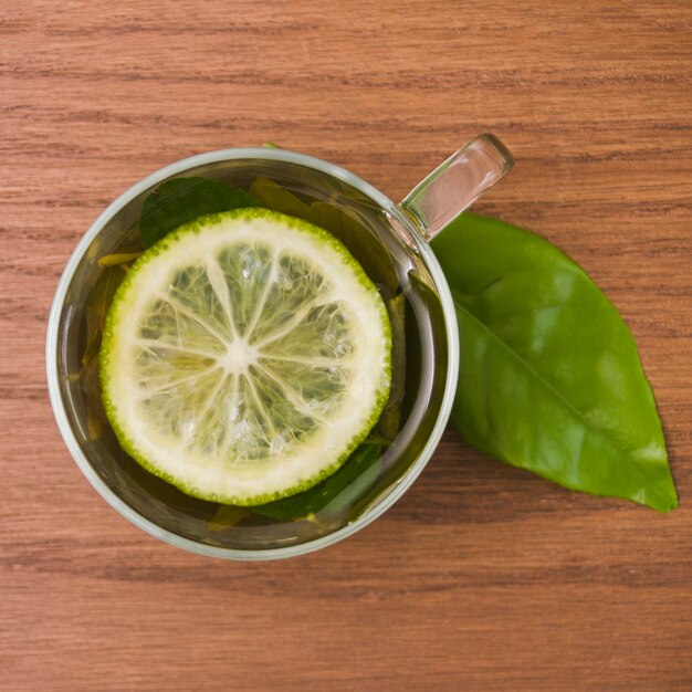 Top view cup of tea with lemon