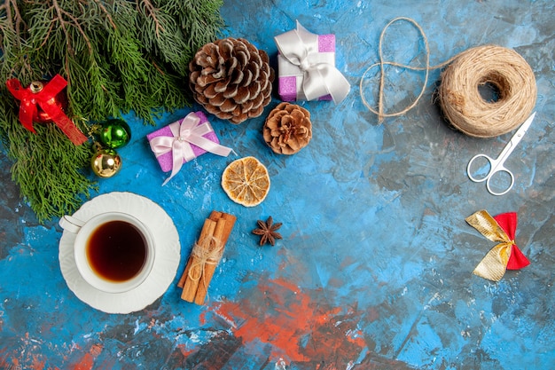 Top view cup of tea with little presents