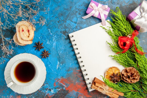 Top view cup of tea with notepad