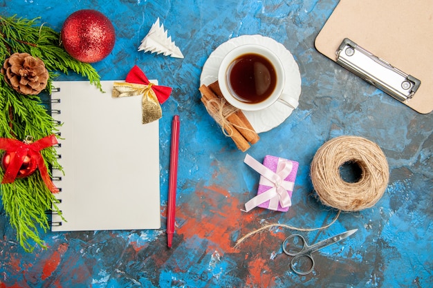 Top view cup of tea with notepad