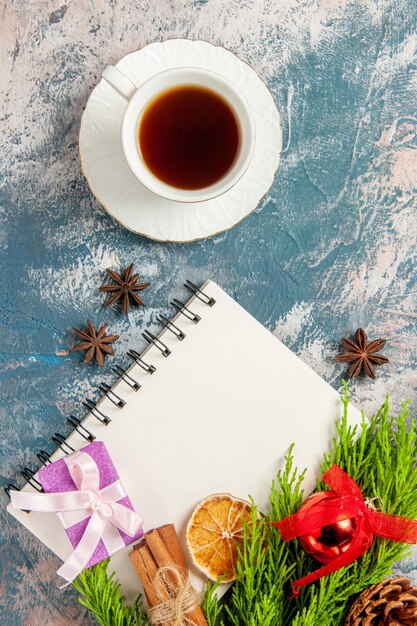 Top view cup of tea with notepad