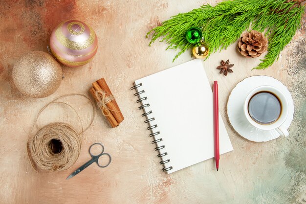 Top view cup of tea with toys and little present