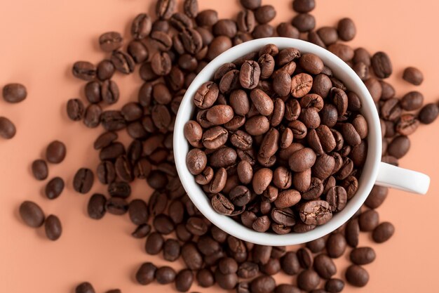 Top view cup with organic coffee beans