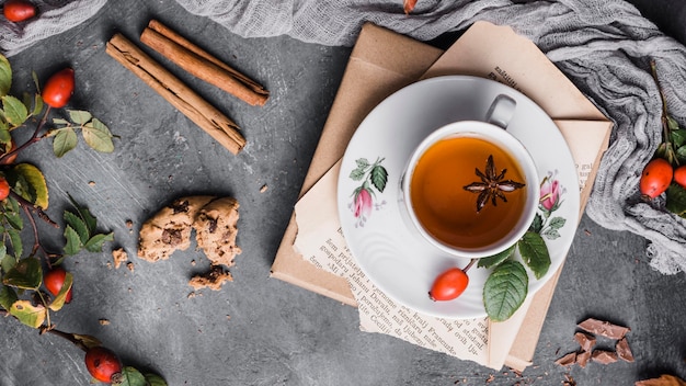 Top view cup with tea, star anise and cinnamon