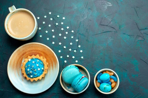 Free photo top view of cupcake with lovely stars decoration on blue dark,