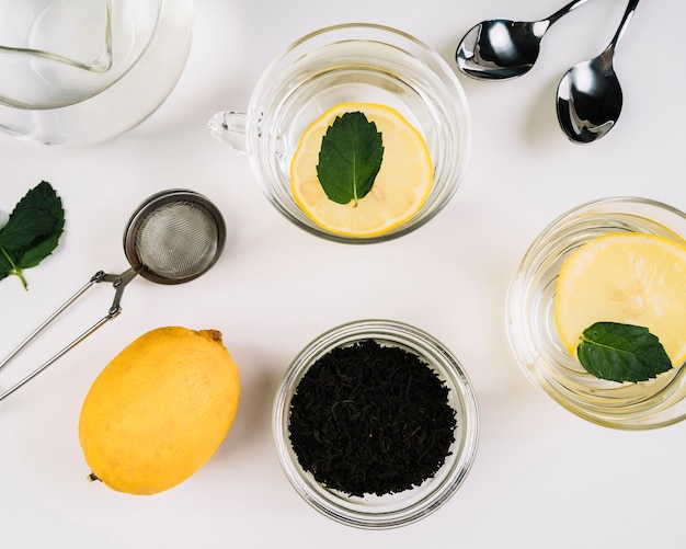 Top view of cups of tea and lemon