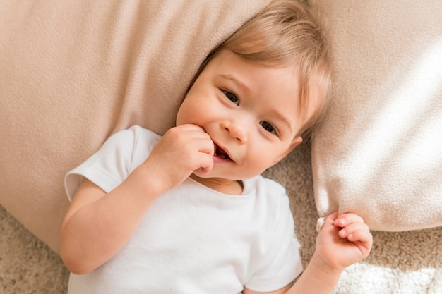 Top view cute baby on pillow