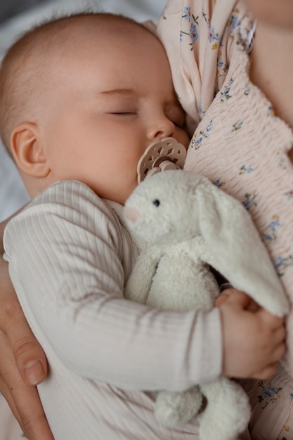 Free photo top view cute baby with stuffed animal