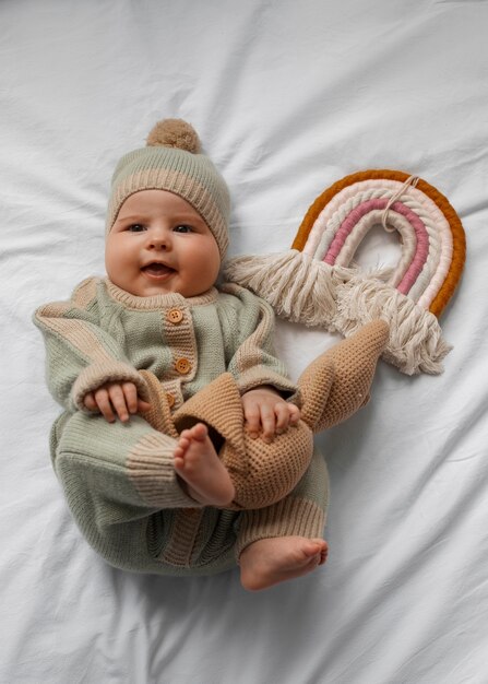 Top view cute baby with stuffed animal