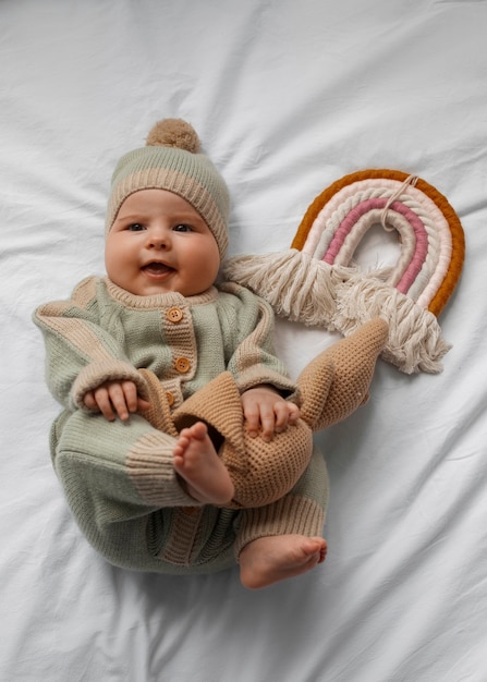 Top view cute baby with stuffed animal