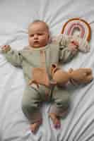 Free photo top view cute baby with stuffed animal