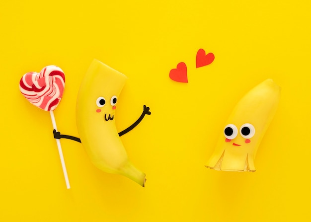 Top view cute bananas with lollipop