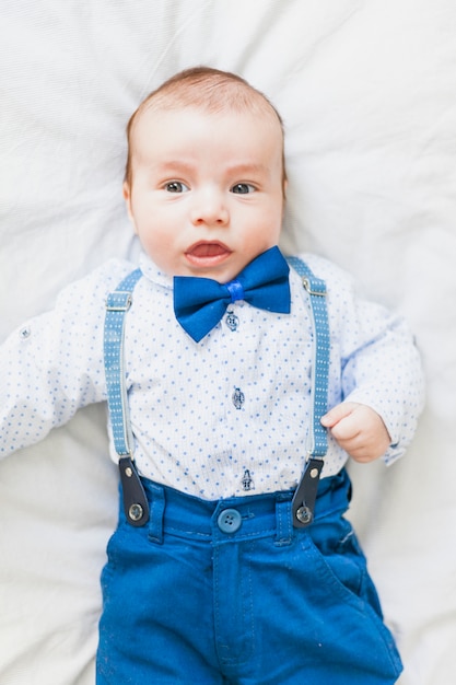Top view cute and elegant baby wearing bow tie