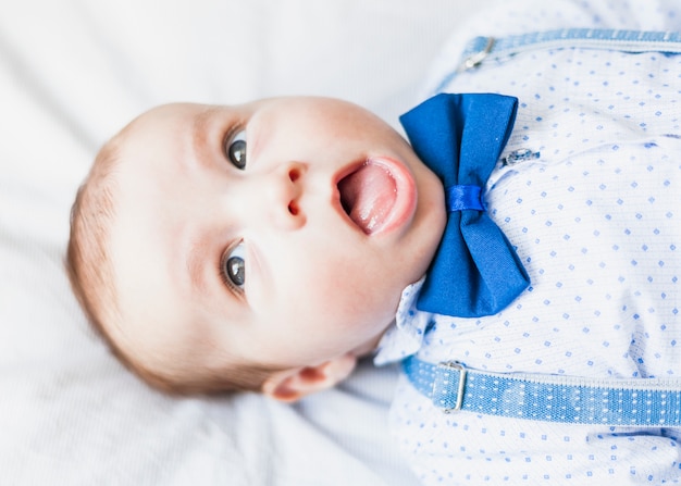 Top view cute and elegant baby wearing bow tie