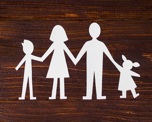 Top view cute family concept composition on wooden background