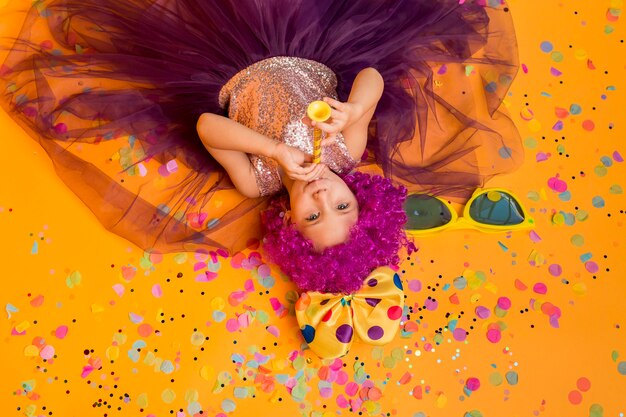 Top view of cute girl with clown wig