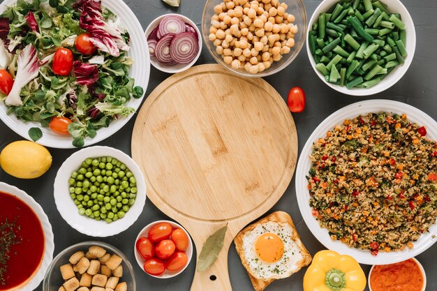 Top view of cutting board with fried egg and green beans