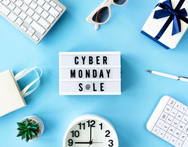 Top view of cyber monday light box with clock and gift