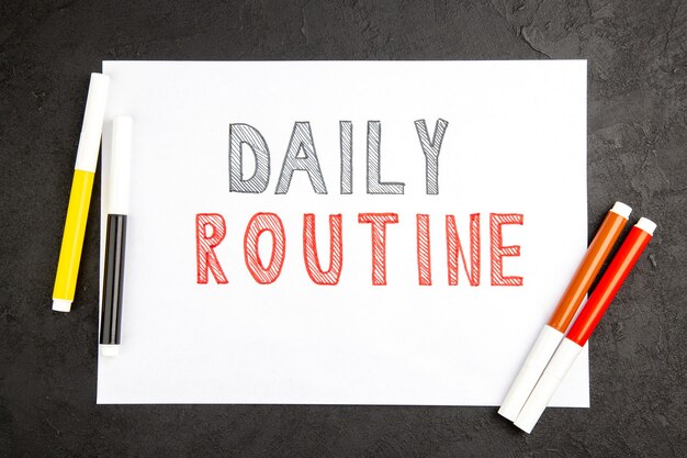 Top view daily routine writing on blank with pencils on dark surface note photo notepad color copybook