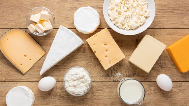 Top view dairy products on wooden background