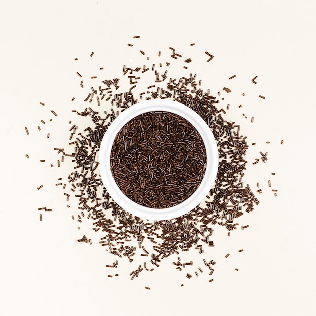 Top view dark chocolate jimmies in a bowl