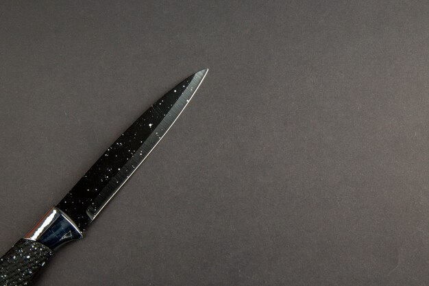top view dark knife on dark background