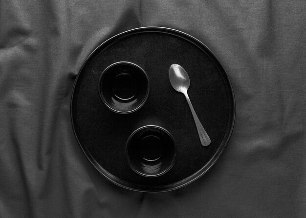 Top view of dark plate with spoon