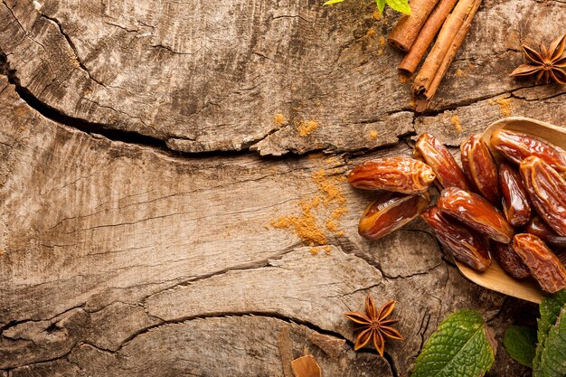 Top view dates and cinnamon sticks