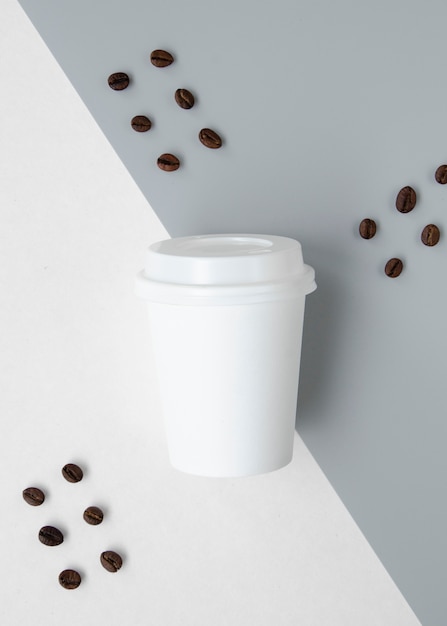 Top view decoration with cup and coffee beans