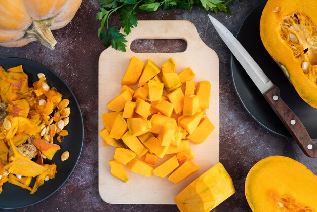 Top view decoration with pumpkin and cutting board