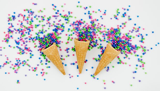 Top view decorative confetti with ice cream cones 