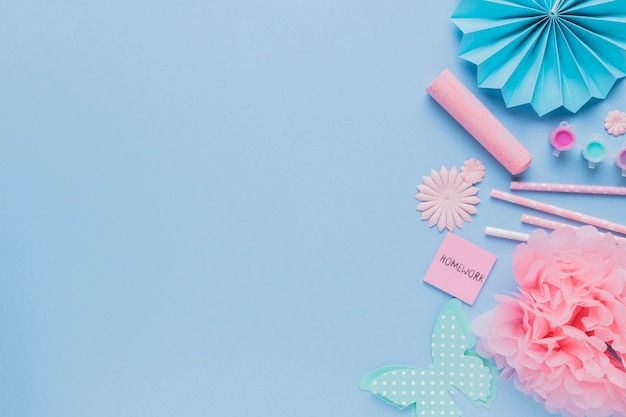 Top view of decorative origami craft art on blue backdrop