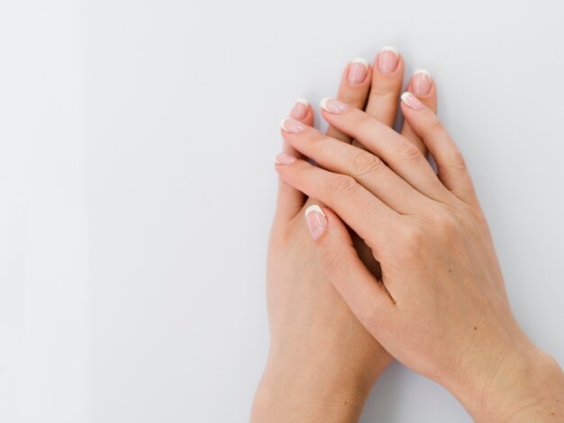 Top view of delicate manicured hands