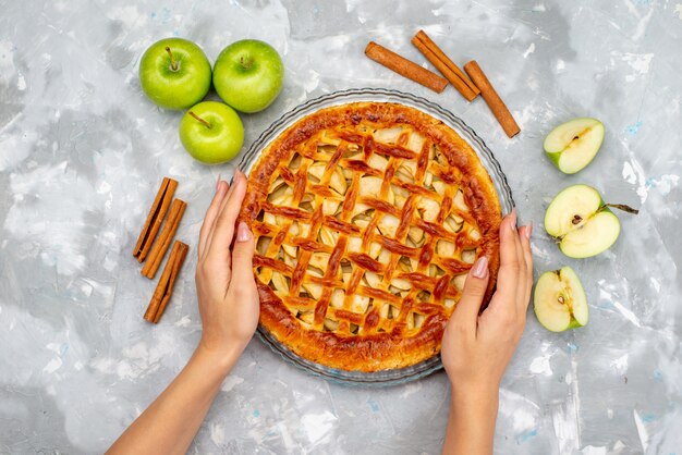 A top view delicious apple cake with fresh green apples cake biscuit  fruit