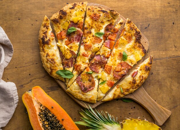 Top view of delicious baked pineapple and papaya pizza