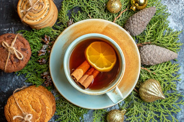 Free photo top view delicious biscuits with cup of tea