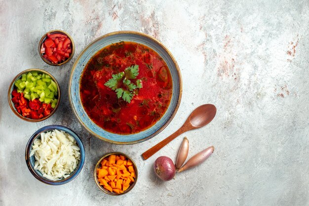 Top view delicious borsch famous ukranian beet soup with meat and pepper on white desk