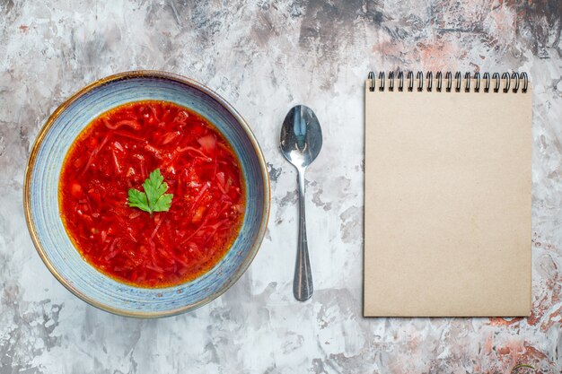 Top view delicious borsch ukrainian beet soup inside plate on white background