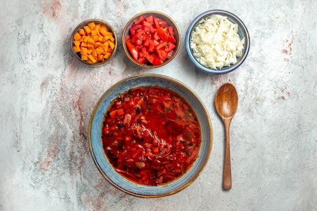 Top view delicious borsch ukranian beet soup on white space